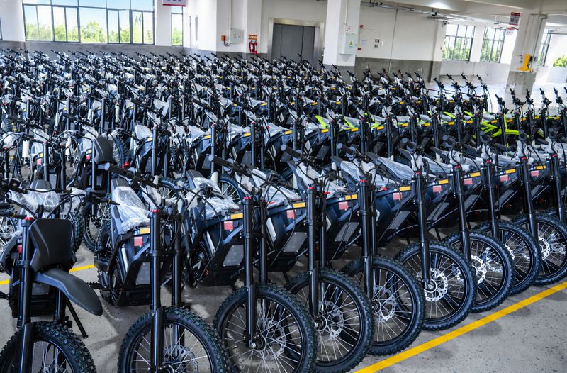 Rows of finished electric dirt bikes ready for shipment